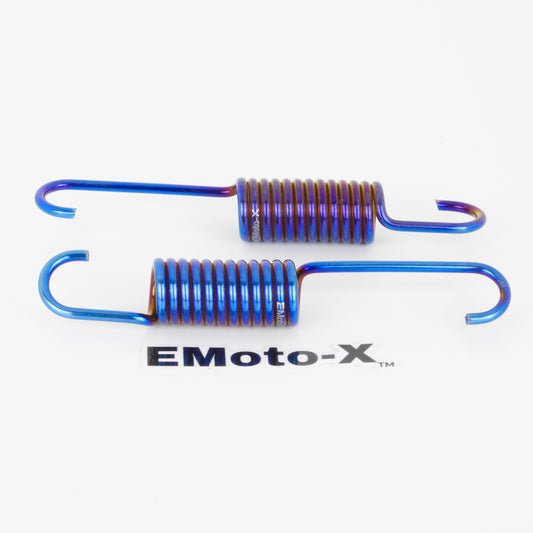 Two Emotox titanium kickstand springs for surron ultra bee electric dirt bikes showing both sides in burnt blue.